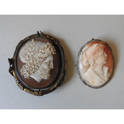 380 - A VICTORIAN PINCHBECK REVOLVING CAMEO MOURNING BROOCH, depicting a Greco-Roman god, along with anoth... 