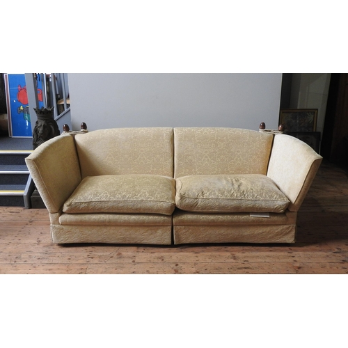 31 - A LARGE THREE SEAT KNOLE SOFA, covered in a gold coloured brocade material, the sofa splits into two... 