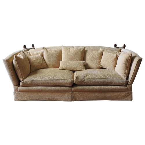 31 - A LARGE THREE SEAT KNOLE SOFA, covered in a gold coloured brocade material, the sofa splits into two... 