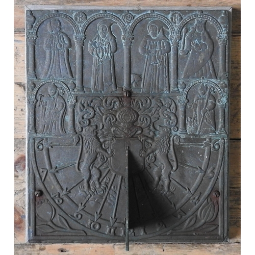 94 - A CAST-IRON WALL MOUNTED SUN DIAL, embossed with medieval figures and heraldic motifs, 38 x 32 cm