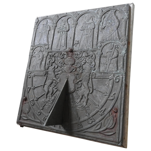 94 - A CAST-IRON WALL MOUNTED SUN DIAL, embossed with medieval figures and heraldic motifs, 38 x 32 cm