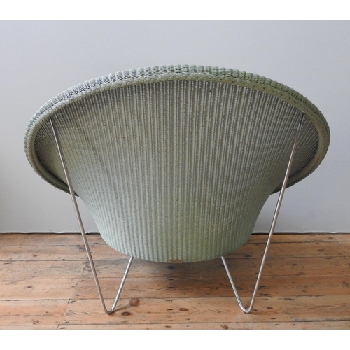 33 - A VINCENT SHEPHERD 'GIPSY LOUNGE' CHAIR, 'Old Lace' colour, polyethylene wicker on steel base. 93 x ... 
