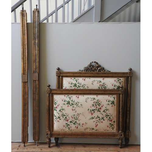 36 - A 19TH CENTURY FRENCH GILT WOOD BED STEAD, with carved foliate scroll work top rails and fluted pill... 