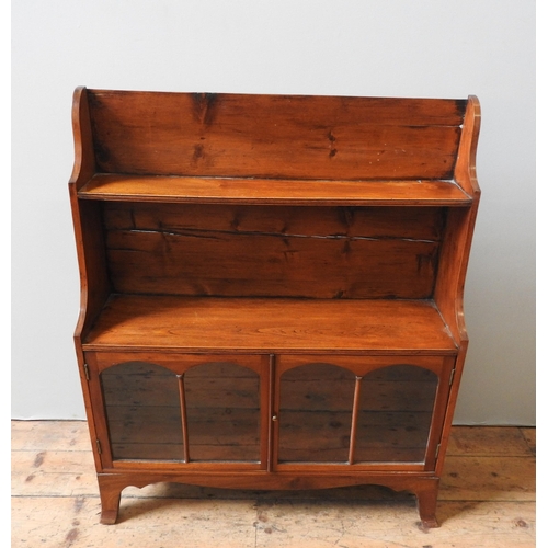 41 - A 19TH CENTURY WATERFALL BOOKCASE, three graduated shelves over two glazed doors, 102 x 85 x 26 cm