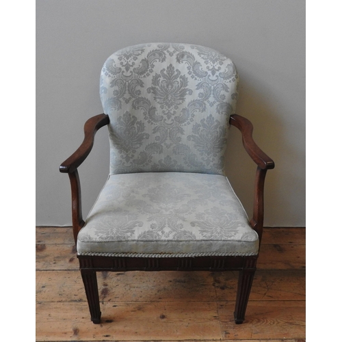 50 - A GEORGE III MAHOGANY ARMCHAIR, with shaped arms, the back and seat covered in pale blue damask mate... 