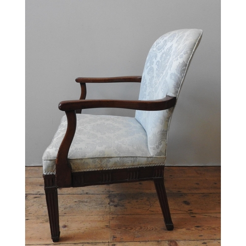 50 - A GEORGE III MAHOGANY ARMCHAIR, with shaped arms, the back and seat covered in pale blue damask mate... 