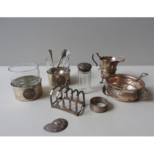 330 - A SILVER CREAM JUG, TOAST RACK, AND A SILVER FEEDING BOWL WITH SPOON, along with a silver conch broo... 