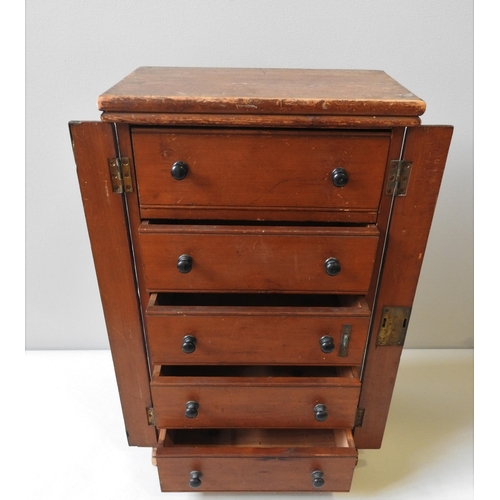 59 - A 19TH CENTURY PINE TABLE TOP SPECIMEN CHEST, comprising of five long drawers flanked by two folding... 
