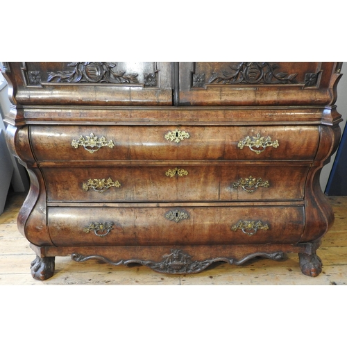 79 - A DUTCH EARLY 19TH CENTURY MAHOGANY LINEN PRESS, the arch stepped cornice sat over two arch molded d... 