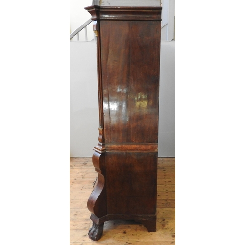 79 - A DUTCH EARLY 19TH CENTURY MAHOGANY LINEN PRESS, the arch stepped cornice sat over two arch molded d... 