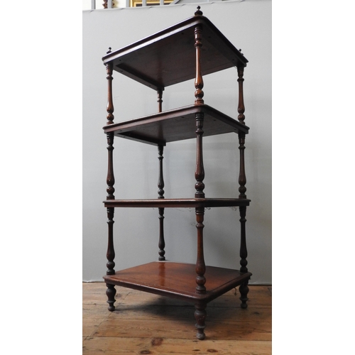 80 - AN EARLY 19TH CENTURY MAHOGANY WHAT NOT, the four shelves united by turned baluster pillars with fin... 