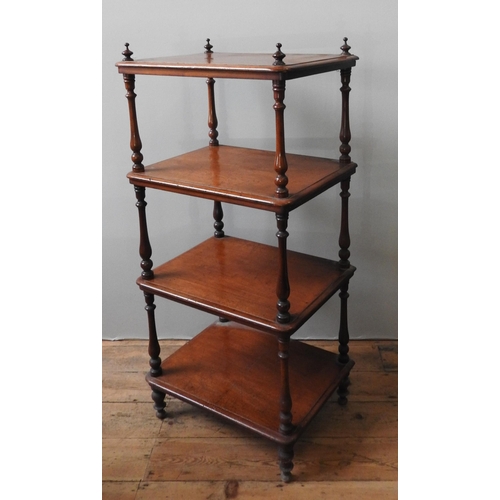 80 - AN EARLY 19TH CENTURY MAHOGANY WHAT NOT, the four shelves united by turned baluster pillars with fin... 