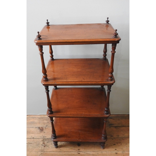 80 - AN EARLY 19TH CENTURY MAHOGANY WHAT NOT, the four shelves united by turned baluster pillars with fin... 