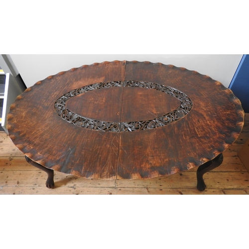 81 - AN UNUSUAL CARVED KASHMIRI WALNUT DINING TABLE, the oval top carved in the form of a lily pad, with ... 