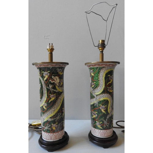 244 - A PAIR OF CHINESE SLEEVE VASES, converted to table lamps, the cylindrical vessels decorated with dra... 