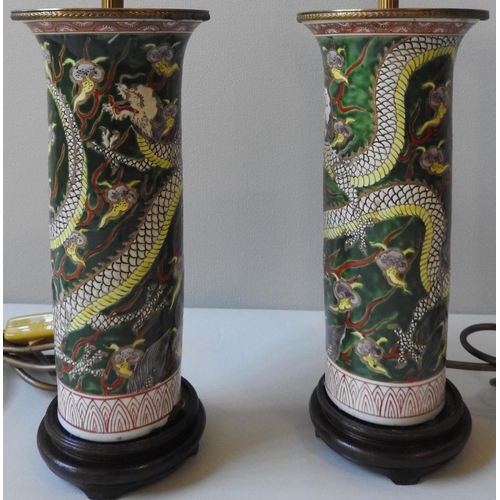 244 - A PAIR OF CHINESE SLEEVE VASES, converted to table lamps, the cylindrical vessels decorated with dra... 