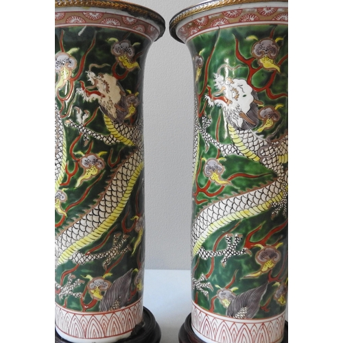 244 - A PAIR OF CHINESE SLEEVE VASES, converted to table lamps, the cylindrical vessels decorated with dra... 