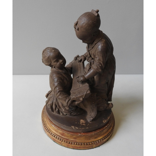 245 - A FRENCH 19TH CENTURY TERRACOTTA GROUP, depicting robed infants playing with Gu Zheng zither, on a c... 