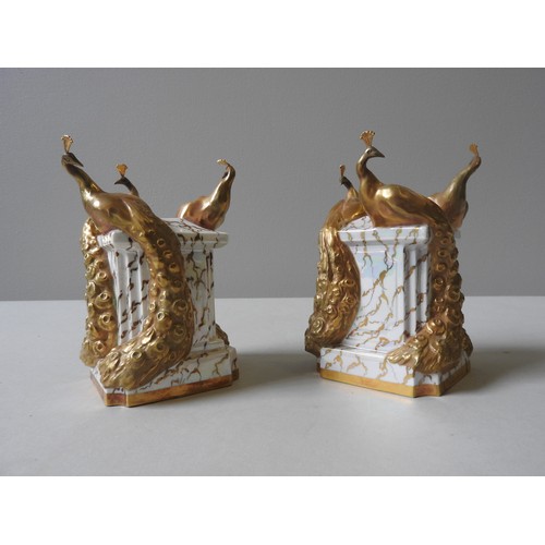 246 - A PAIR OF ROYAL WORCESTER STANDS, with peacocks, 15 x 10 cm