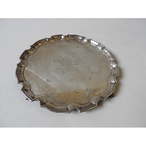 359 - A SILVER SALVER, with scroll work edge, on four claw and ball feet, by Ellis & Co, Birmingham, c... 