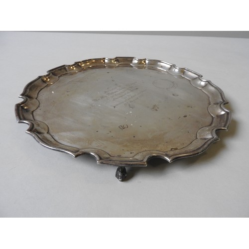 359 - A SILVER SALVER, with scroll work edge, on four claw and ball feet, by Ellis & Co, Birmingham, c... 