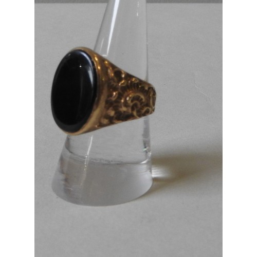 376 - A 9CT GOLD SIGNET RING, set with an oval black onyx, the shoulders engraved with rococo-style acanth... 