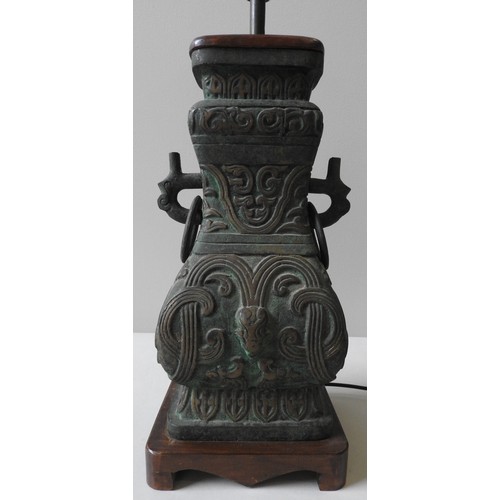 112 - A CHINESE STYLE CAST METAL TABLE LAMP, the base 44 x 21 x 17 cm (90cm high inc shade)