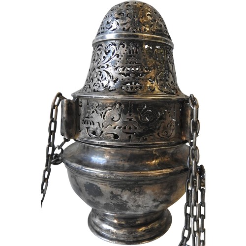A RARE QUEEN ANNE SILVER ECCLESIASTICAL THURIBLE, of baluster caster form with ornate pierced cover on a pedestal base, dependent on three chains, circa 1702, London, by silversmith Anthony Nelme, 18.5 cm high, 15 oz (excluding chains)