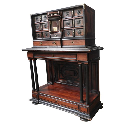 69 - A CONTINENTAL 19TH CENTURY ROSEWOOD VARGUENO CABINET, with brass inlay and gilt metal mounts, the to... 