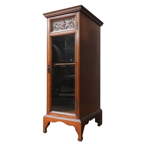 65 - AN EDWARDIAN MAHOGANY CABINET, of narrow form, with a carved frieze pane with foliate and Grecian ur... 