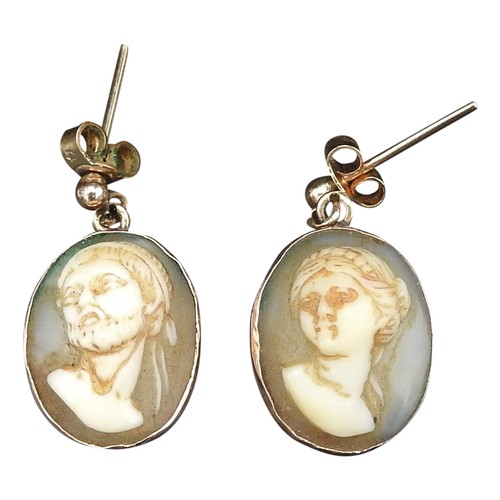 368 - A PAIR OF CAMEO EARRINGSOne depicting a female bust and the other a male bust.Unmarked yellow metal.... 