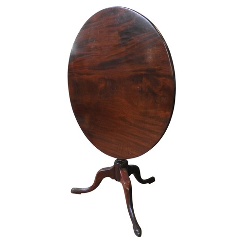 72 - A GEORGE III MAHOGANY TILT-TOP TRIPOD TABLE, the single piece top raised on a turned baluster pedest... 