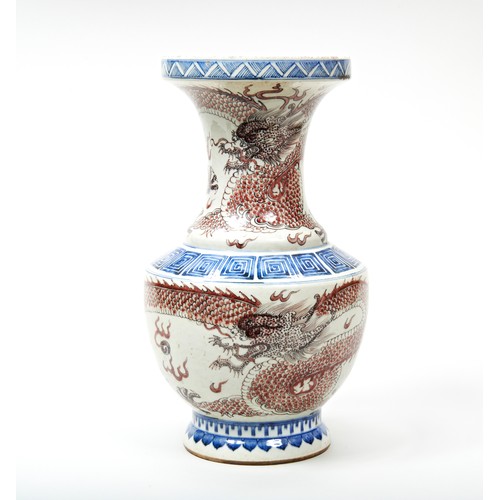 248 - UNDERGLAZE-BLUE AND COPPER RED 'DRAGON' VASE20TH CENTURYthe neck and body decorated with bold scally... 