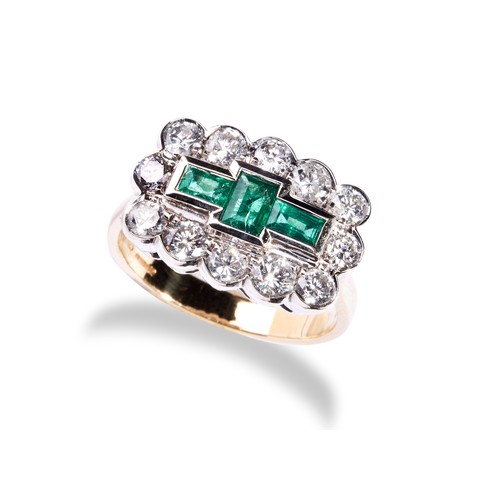 113 - AN EMERALD AND DIAMOND RING set with three baguette-cut diamonds, collet set within a bezel of twelv... 