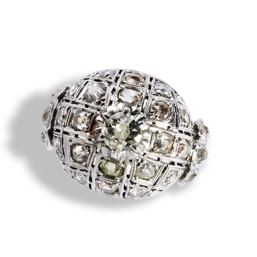 114 - A DIAMOND BOMBE DRESS RING a central round cut diamond set above a dome set with eighteen old cut di... 