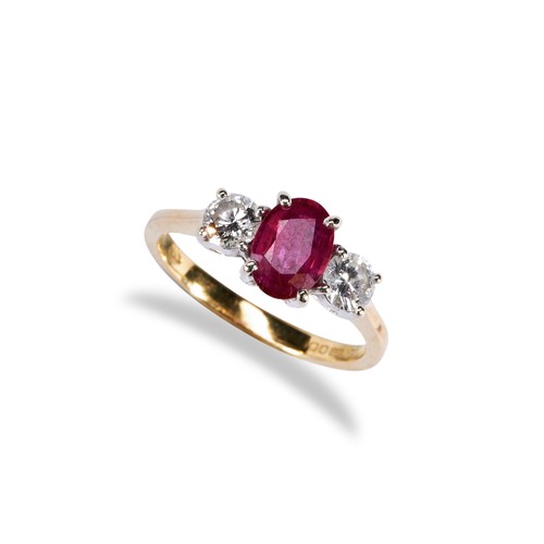 116 - A RUBY AND DIAMOND THREE STONE RING the central oval mixed-cut ruby between two round cut diamonds o... 