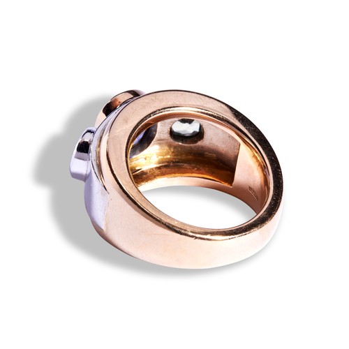 73 - THEO FENNELL SAPPHIRE RING an oval cut sapphire collet set in rose gold between two round cut green ... 