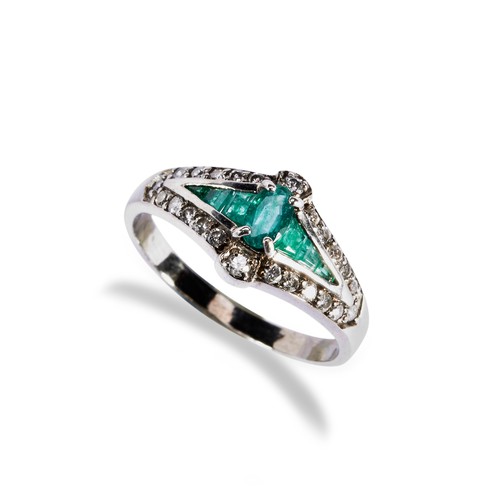 143 - AN EMERALD AND DIAMOND DRESS RING, CIRCA 1900 the central oval emerald set above six channel set tap... 