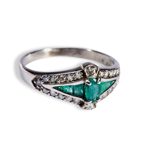 143 - AN EMERALD AND DIAMOND DRESS RING, CIRCA 1900 the central oval emerald set above six channel set tap... 