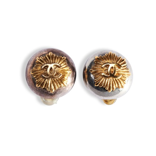 66 - CHANEL 1997;A PAIR OF TWO TONE EARRINGS of dome design with applied gilded entwined 'Cs' against a s... 