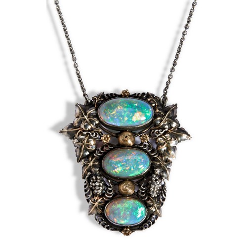 132 - H.G. MURPHY  AN ARTS & CRAFTS OPAL SILVER AND GOLD PENDANT NECKLACE,  collet set with three grad... 