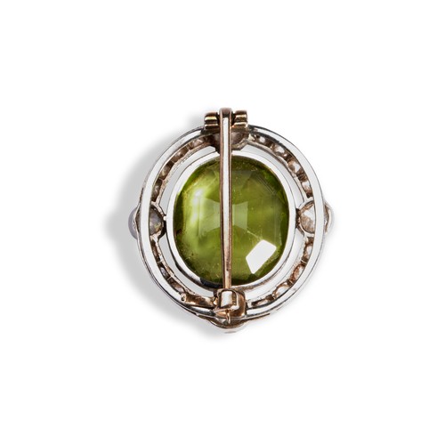 148 - A NINETEENTH CENTURY PERIDOT AND DIAMOND BROOCH, CIRCA 1900,  the oval mixed-cut peridot within a ha... 