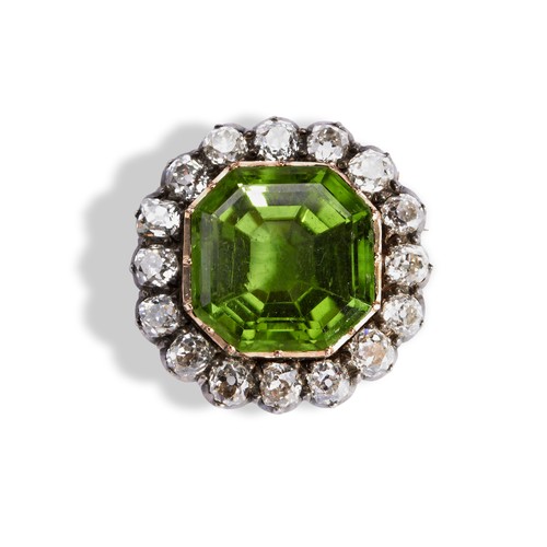 147 - A NINETEENTH CENTURY PERIDOT AND DIAMOND SET BROOCH, CIRCA 1870 the cushion-cut peridot within a bor... 