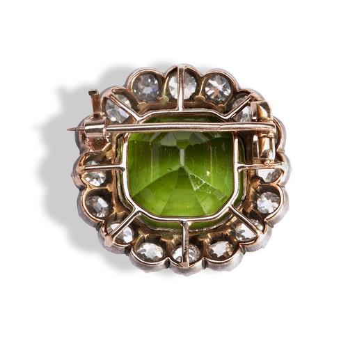 147 - A NINETEENTH CENTURY PERIDOT AND DIAMOND SET BROOCH, CIRCA 1870 the cushion-cut peridot within a bor... 