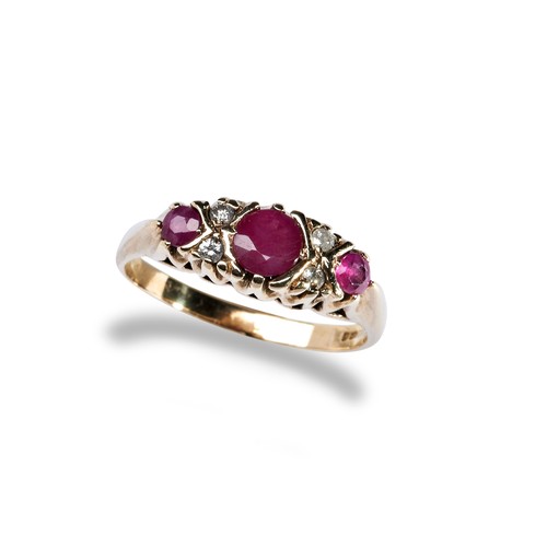 118 - A RUBY AND DIAMOND DRESS RING the three graduated round mixed-cut rubies with four round cut diamond... 