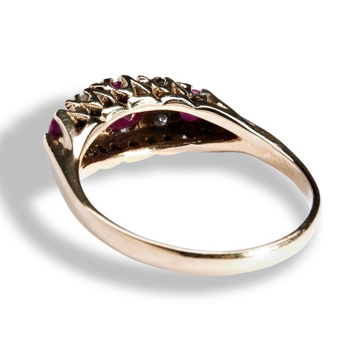 118 - A RUBY AND DIAMOND DRESS RING the three graduated round mixed-cut rubies with four round cut diamond... 