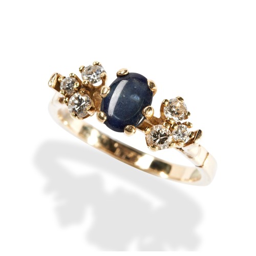 115 - A SAPPHIRE AND DIAMOND RING  the oval cabochon-cut sapphire, six between trefoils of brilliant-cut d... 