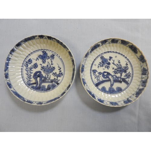 79 - PAIR OF SMALL LOTUS-PETAL MOULDED BLUE AND WHITE DISHESKANGXI PERIOD (1662-1722)each painted in tone... 