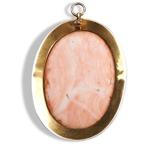 130 - A VICTORIAN GOLD AND CORAL CAMEO PENDANT, Circa 1880the oval coral cameo carved to depict the bust o... 