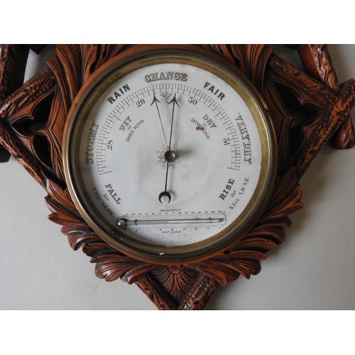 182 - A 19TH CENTURY WALL MOUNTED CLOCK / BAROMETER, in an unusual lozenge shaped mahogany case, ornately ... 